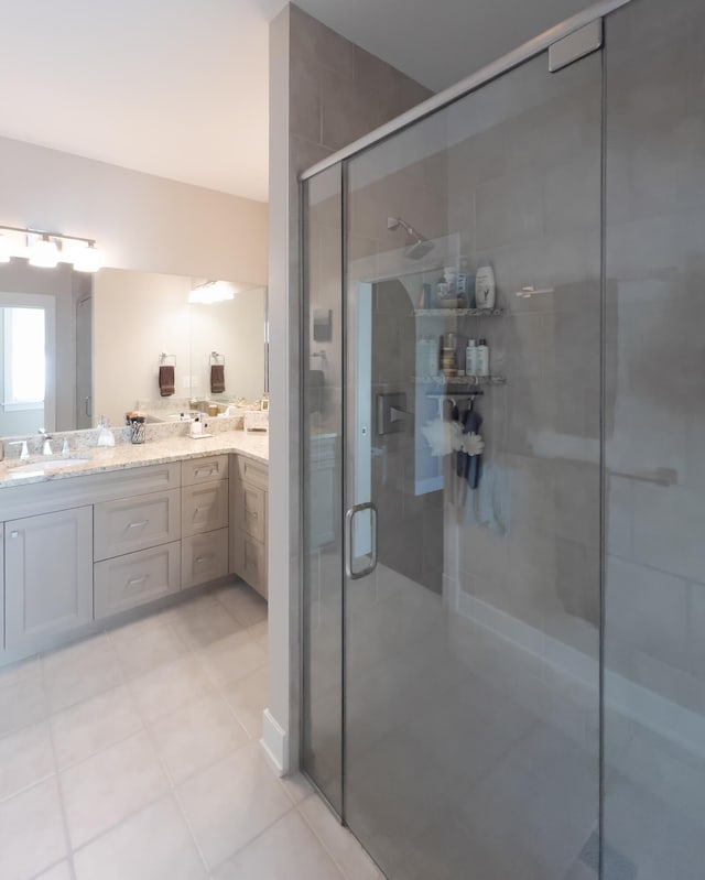 300 Morning Walk Path, Benton Harbor, MI 49022 - full bathroom featuring a stall shower, double vanity, and tile patterned floors