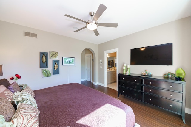 300 Morning Walk Path, Benton Harbor, MI 49022 - bedroom with arched walkways, dark wood-style flooring, baseboards, and ensuite bath