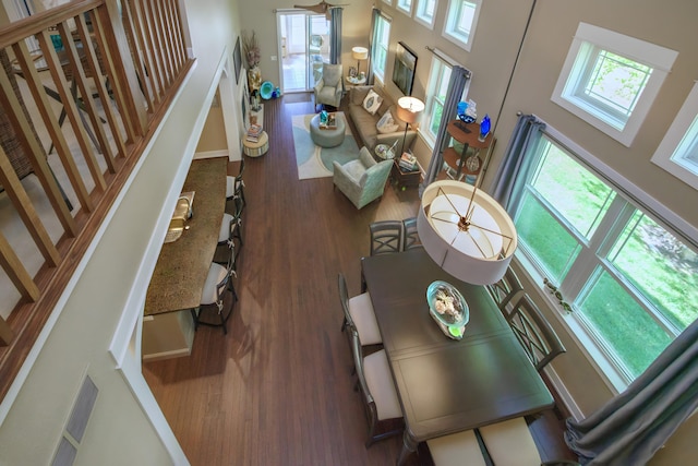 300 Morning Walk Path, Benton Harbor, MI 49022 - living area featuring wood finished floors, stairs, a high ceiling, and baseboards