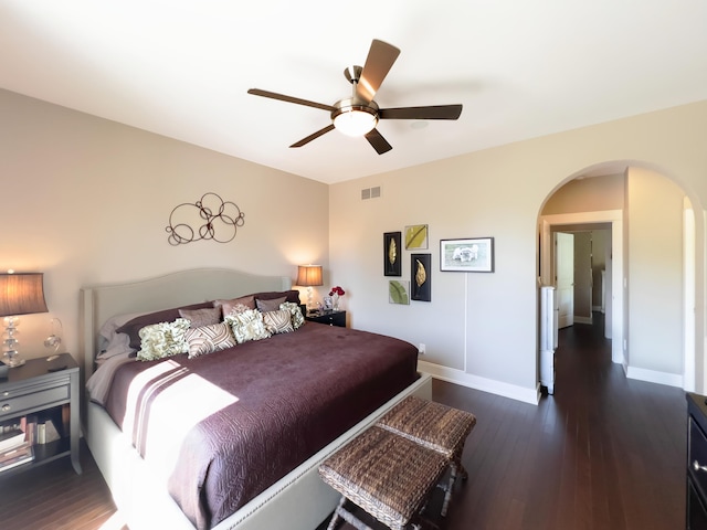 300 Morning Walk Path, Benton Harbor, MI 49022 - bedroom with arched walkways, dark wood-style floors, baseboards, and a ceiling fan