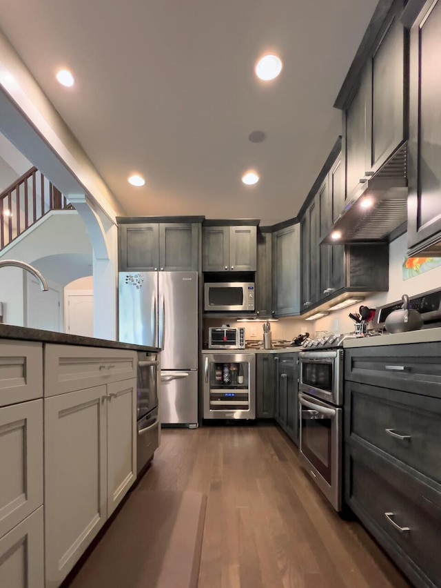 300 Morning Walk Path, Benton Harbor, MI 49022 - kitchen featuring under cabinet range hood, beverage cooler, stainless steel appliances, a sink, and dark wood-style flooring