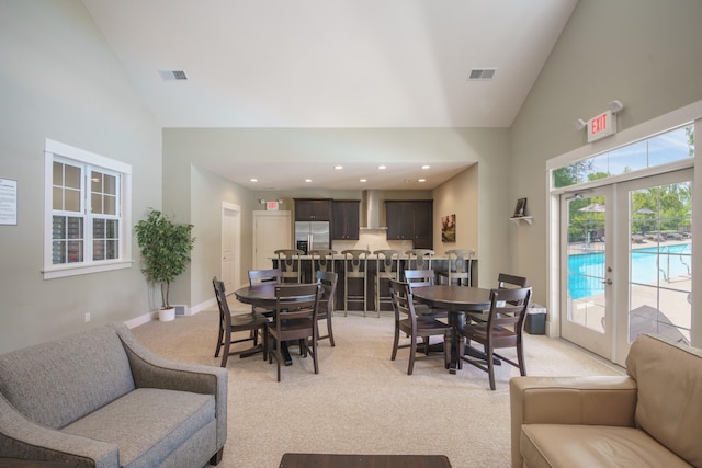 300 Morning Walk Path, Benton Harbor, MI 49022 - dining area with high vaulted ceiling, light carpet, and recessed lighting