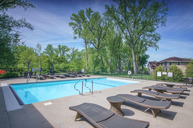 300 Morning Walk Path, Benton Harbor, MI 49022 - community pool featuring a patio and view of wooded area
