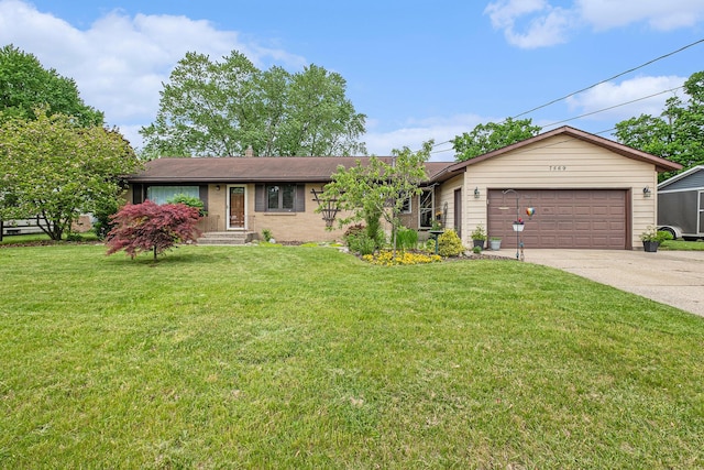 7569 Astronaut Ave, Jenison, MI 49428 - ranch-style home with driveway, an attached garage, a front yard, and brick siding