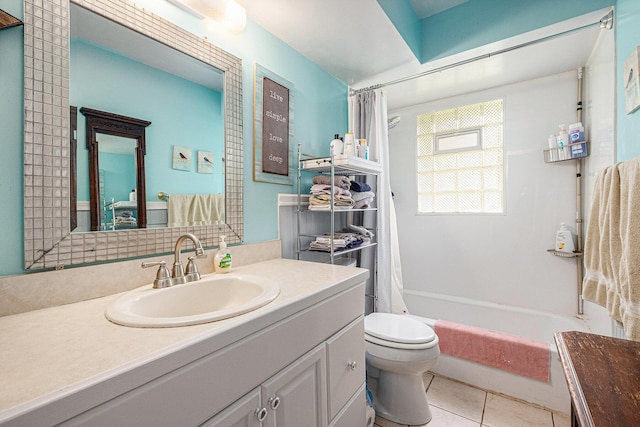 7569 Astronaut Ave, Jenison, MI 49428 - bathroom featuring vanity, toilet, shower / bath combo with shower curtain, and tile patterned flooring