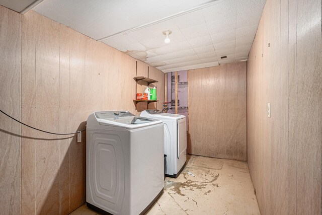 7569 Astronaut Ave, Jenison, MI 49428 - laundry room with independent washer and dryer and wooden walls