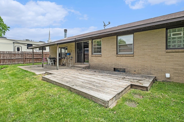 7569 Astronaut Ave, Jenison, MI 49428 - rear view of house with brick siding, a deck, and a patio