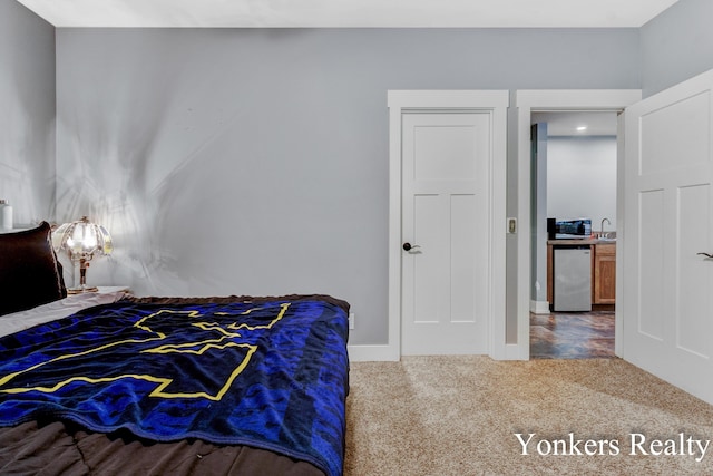 1109 Kenowa Ave SW, Byron Center, MI 49315 - bedroom with carpet, refrigerator, a sink, and baseboards
