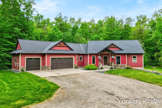 1109 Kenowa Ave SW, Byron Center, MI 49315 - view of front facade with an attached garage, driveway, stone siding, and a front lawn