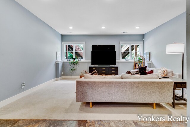 1109 Kenowa Ave SW, Byron Center, MI 49315 - carpeted living area featuring baseboards and recessed lighting