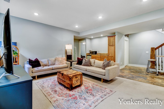 1109 Kenowa Ave SW, Byron Center, MI 49315 - living room featuring stairway, recessed lighting, stone finish flooring, and baseboards