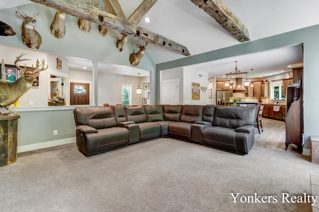 1109 Kenowa Ave SW, Byron Center, MI 49315 - living area with recessed lighting, light carpet, beamed ceiling, a chandelier, and baseboards
