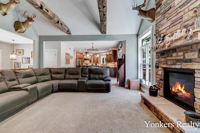 1109 Kenowa Ave SW, Byron Center, MI 49315 - living room with light carpet, a fireplace, beamed ceiling, and high vaulted ceiling
