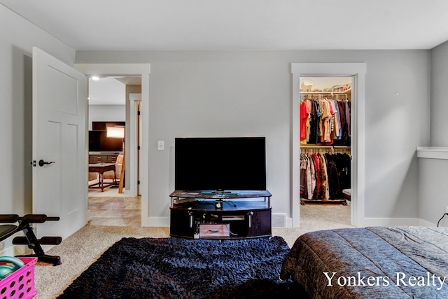 1109 Kenowa Ave SW, Byron Center, MI 49315 - carpeted bedroom with a spacious closet and a closet