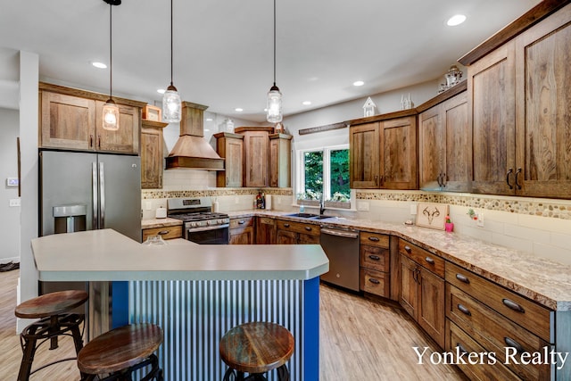 1109 Kenowa Ave SW, Byron Center, MI 49315 - kitchen with appliances with stainless steel finishes, custom range hood, a sink, backsplash, and recessed lighting