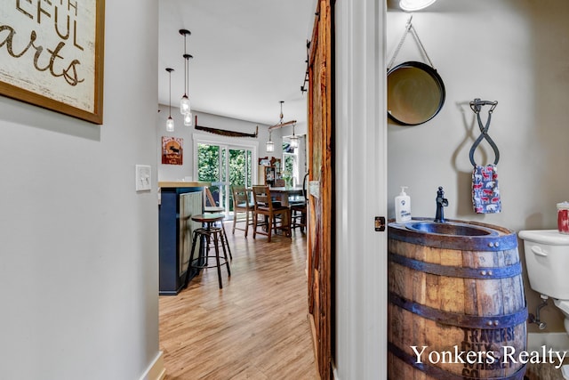 1109 Kenowa Ave SW, Byron Center, MI 49315 - hall featuring light wood-style floors and a sink