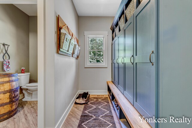 1109 Kenowa Ave SW, Byron Center, MI 49315 - mudroom featuring baseboards and wood finished floors