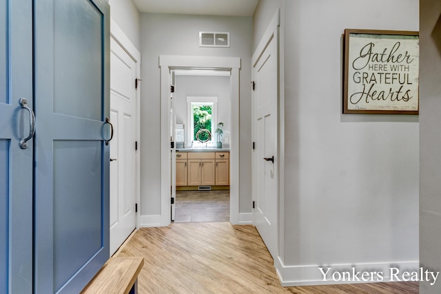 1109 Kenowa Ave SW, Byron Center, MI 49315 - hall with light wood finished floors and baseboards