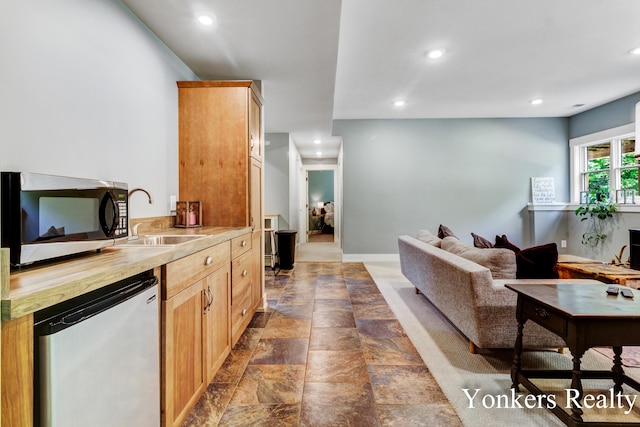 1109 Kenowa Ave SW, Byron Center, MI 49315 - living room with recessed lighting and stone finish flooring