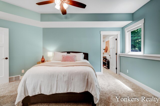 1109 Kenowa Ave SW, Byron Center, MI 49315 - carpeted bedroom with baseboards and a ceiling fan