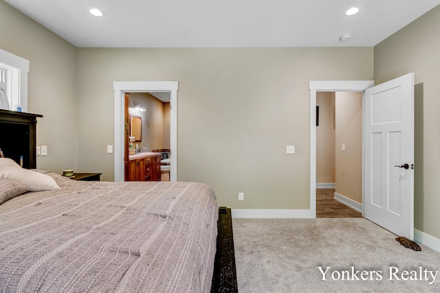 1109 Kenowa Ave SW, Byron Center, MI 49315 - carpeted bedroom featuring baseboards, recessed lighting, and connected bathroom
