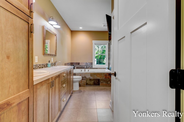 1109 Kenowa Ave SW, Byron Center, MI 49315 - full bathroom with a garden tub, double vanity, tile patterned floors, toilet, and recessed lighting