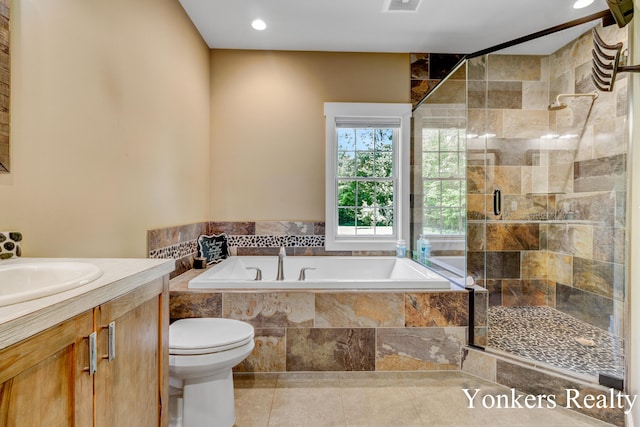 1109 Kenowa Ave SW, Byron Center, MI 49315 - full bath with a garden tub, a stall shower, vanity, toilet, and tile patterned floors