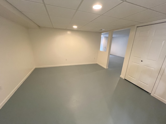 5764 W Brookwood Pl, Ludington, MI 49431 - finished below grade area with baseboards, a drop ceiling, and recessed lighting