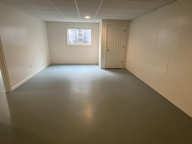 5764 W Brookwood Pl, Ludington, MI 49431 - unfurnished room featuring concrete floors, a paneled ceiling, and recessed lighting