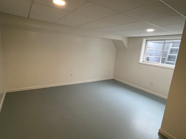 5764 W Brookwood Pl, Ludington, MI 49431 - basement featuring a paneled ceiling, recessed lighting, and baseboards
