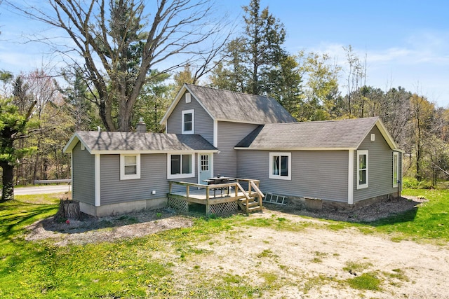 4371 N 68th Ave, Hart, MI 49420 - back of property with a wooden deck and roof with shingles