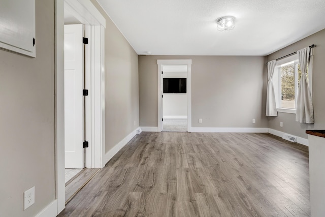 4371 N 68th Ave, Hart, MI 49420 - unfurnished room featuring wood finished floors and baseboards