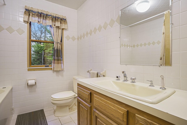 4900 N Railroad Ave, Pentwater, MI 49449 - bathroom featuring tile walls, toilet, vanity, a tub to relax in, and a shower