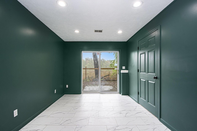 11199 W Harlow Rd, Greenville, MI 48838 - spare room featuring light marble finish flooring, baseboards, and recessed lighting