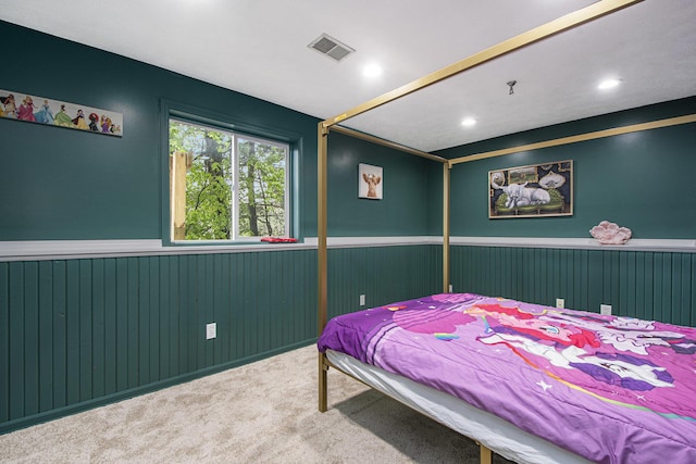 11199 W Harlow Rd, Greenville, MI 48838 - bedroom featuring a wainscoted wall, carpet floors, recessed lighting, and wood walls