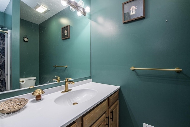 11199 W Harlow Rd, Greenville, MI 48838 - bathroom featuring vanity and toilet