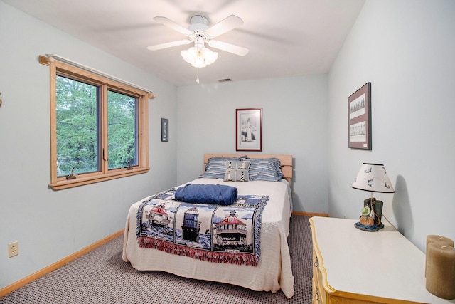 6818 W Vesper Dr, Ludington, MI 49431 - carpeted bedroom featuring baseboards and ceiling fan