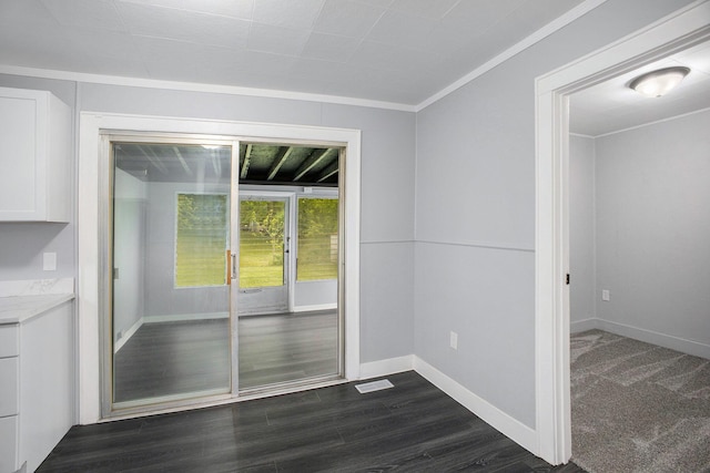 407 S Maurice Ave, Jackson, MI 49203 - unfurnished dining area with ornamental molding, baseboards, and dark wood-type flooring