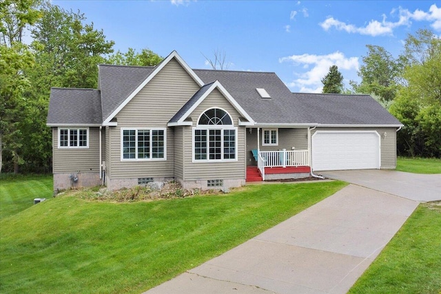 306 Meister Rd, Fremont, MI 49412 - view of front of property with a front lawn, concrete driveway, and a garage