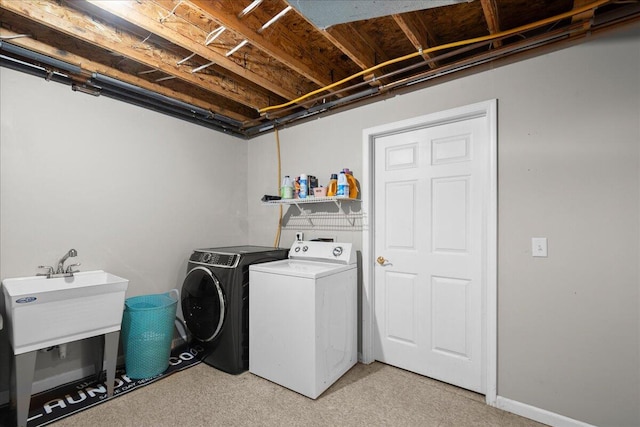 306 Meister Rd, Fremont, MI 49412 - washroom with washing machine and dryer and a sink