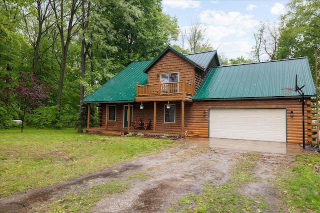 65 N Brown Rd, Bailey, MI 49303 - cabin with dirt driveway, covered porch, metal roof, an attached garage, and a front yard