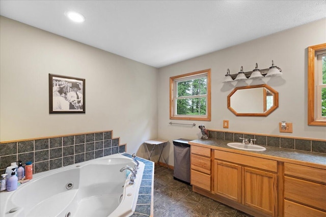65 N Brown Rd, Bailey, MI 49303 - full bath with vanity and a whirlpool tub
