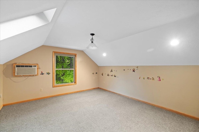 65 N Brown Rd, Bailey, MI 49303 - bonus room with a skylight, light carpet, baseboards, vaulted ceiling, and a wall mounted AC