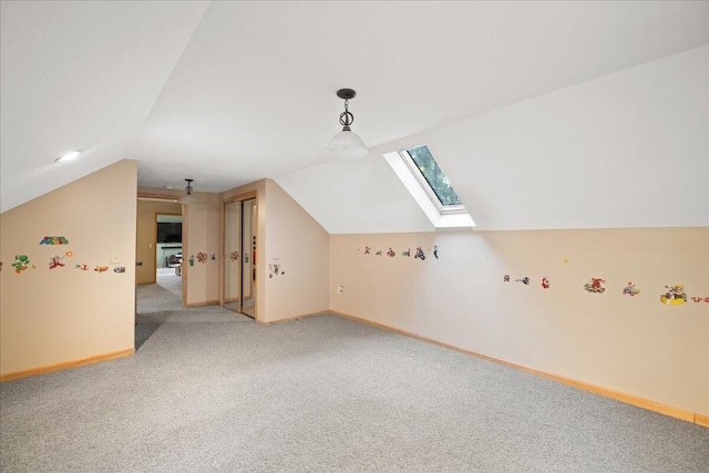 65 N Brown Rd, Bailey, MI 49303 - additional living space featuring a skylight, lofted ceiling, light carpet, and baseboards