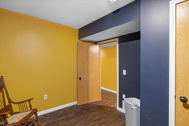 65 N Brown Rd, Bailey, MI 49303 - living area featuring dark wood finished floors and baseboards