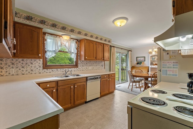 70594 Dennis Dr, Niles, MI 49120 - kitchen featuring white appliances, a sink, brown cabinetry, and light countertops