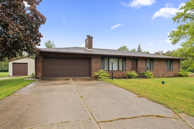 70594 Dennis Dr, Niles, MI 49120 - ranch-style house featuring brick siding, a front lawn, and an attached garage