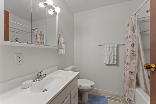 70594 Dennis Dr, Niles, MI 49120 - full bath with tile patterned floors, vanity, toilet, shower / tub combo with curtain, and baseboards