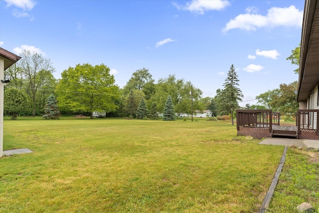 70594 Dennis Dr, Niles, MI 49120 - view of green lawn with a wooden deck