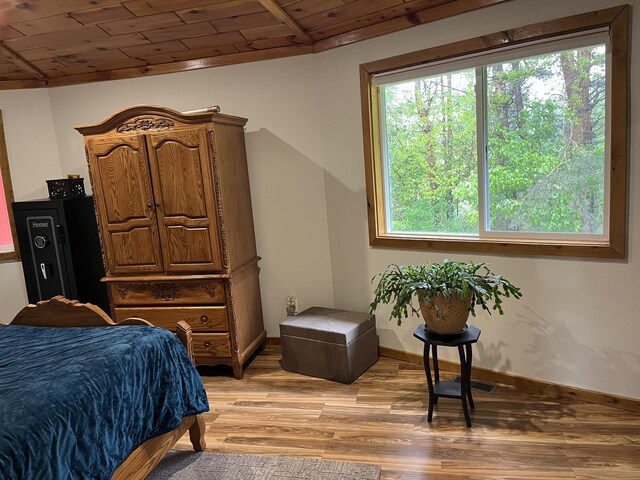 550 E N St, Edmore, MI 48829 - bedroom with wooden ceiling, light wood-style floors, vaulted ceiling, and baseboards